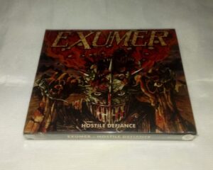 Exumer – Hostile Defience ( Slipcase ) + (Poster)